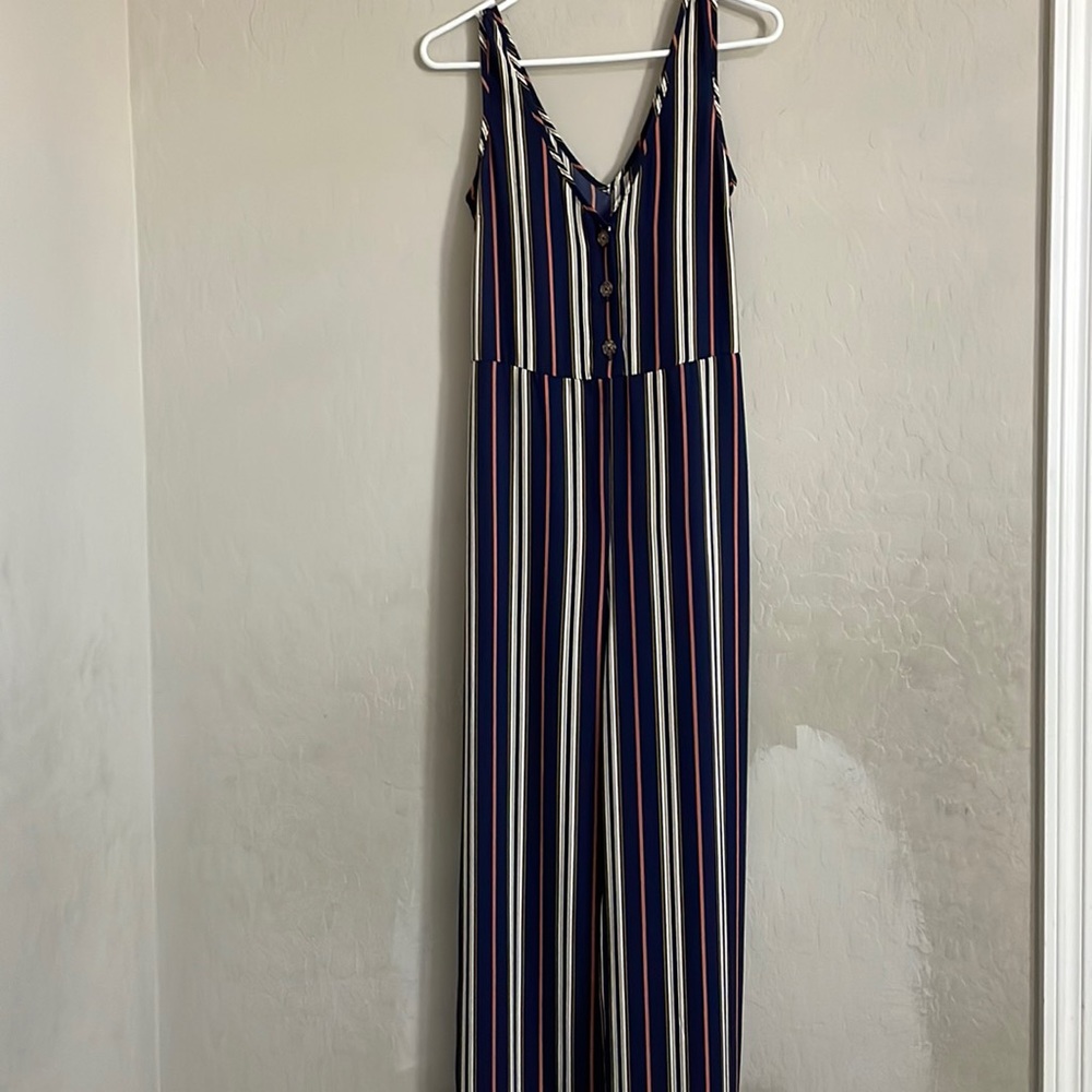 The brand is xhilaration, small. Colors are blue, orange, yellow and white.